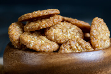 oatmeal thin round cookies with lots of sesame seeds
