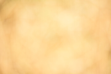 Light shining down on gold wall with copy space, abstract background