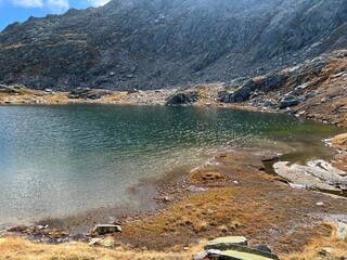 Early autumn on the alpine lakes Laghi della Valletta in the mountainous area of the St. Gotthard...