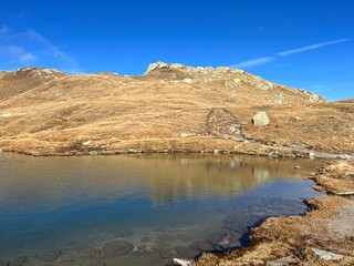 Early autumn on the alpine lakes Laghi della Valletta in the mountainous area of the St. Gotthard...
