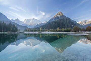Lake Jasna in Kranjska Gora Slovenia, Julian alps mountain turqoise lake with peak reflections in the morning