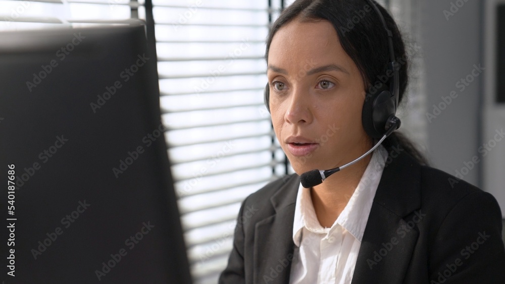 Aufkleber competent female operator working on computer and talking with clients. concept relevant to both cal