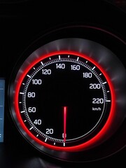 speedometer on black background