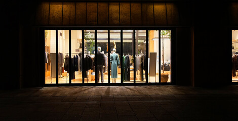Show windows on the street at night in the shopping district