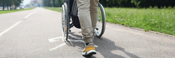 Obraz premium Man drive person in wheelchair, friend visit someone in nursing house