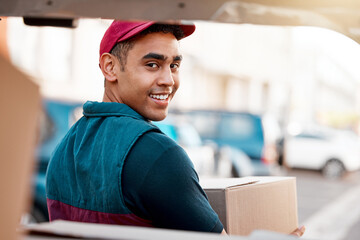 Logistics, smile and man with box at van looking back, trust and success in courier service for ecommerce business. Supply chain, cargo and stock distribution, delivery driver at truck with package. © Jesse B/peopleimages.com