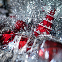 Christmas decoration of red pine with snow texture and red shining ball in silver and dark garland