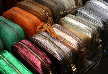 some purses made with leather and zippers for sale in the shop