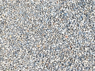 Top view of crushed stone texture, small rubble rocks background