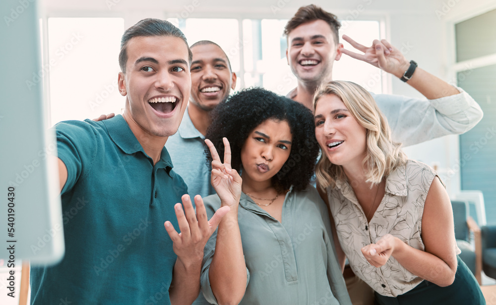 Wall mural Happy employees, selfie and team building in office for business people happy, smile and peace sign posing for picture. Diversity, teamwork and collaboration photo with fun men and women work friends