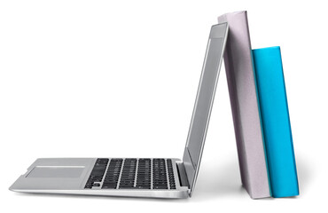 Laptop and books isolated on white background. Modern education and on-line learning