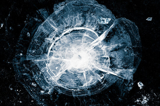 Ice, crushed on black background. Ice surface with cracks.