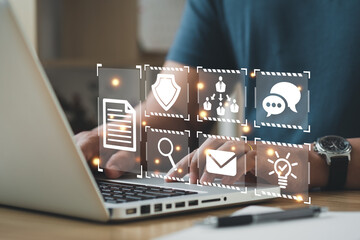 Records keeping, database technology, file access, doc sharing..Businessman using a computer to document management concept, online documentation database and digital file storage system or software.