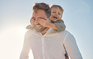 Happy family, father and child hands covering dads eyes at a beach in summer, playing and having...