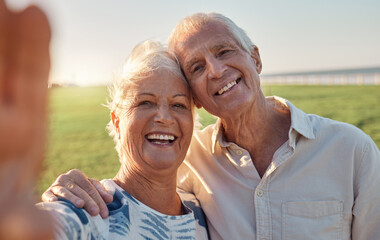 Selfie, smile and senior couple in nature for a holiday in Argentina during their retirement together. Happy, smile and portrait of an elderly man and woman with a photo on a vacation in a park