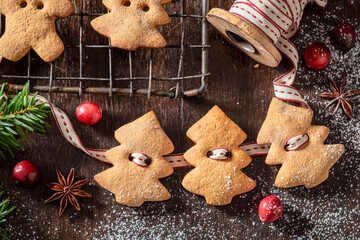 Tasty gingerbread cookies chain for Christmas tree.