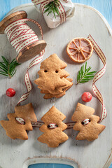 Handmade gingerbread cookies chain as Christmas decoration.