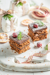 Sweet Gingerbread cake with jam and chocolate glaze for Christmas.