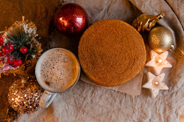 coffee in a designer mug and homemade honey cake on a wooden table in a New Year atmosphere. cozy christmas, cozy winter. High quality photo