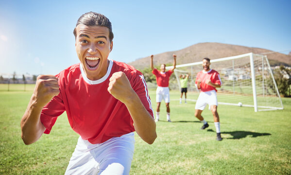 Soccer Player, Celebrate And Winning Team With Fist In Celebration Of Scoring Goal For Sport Match, Game Or Competition With Success Gesture. Victory And Fun With Men Training On Football Field