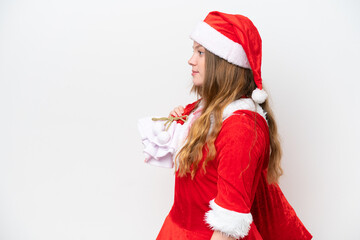 Young caucasian woman with Christmas dress holding Christmas sack isolated on white background with happy expression