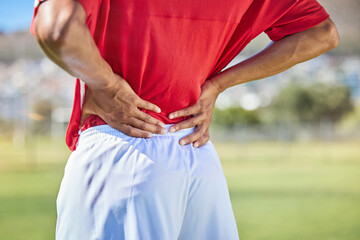 Field, soccer and man with back injury in game tournament with pain, inflammation and backache....