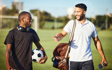 Soccer players, friends and men walking on football field after practice or fitness training on...