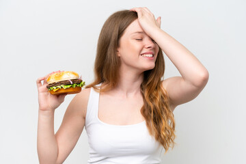 Young pretty woman holding a burger isolated on white background has realized something and intending the solution