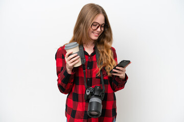 Young photographer pretty woman isolated on white background holding coffee to take away and a...