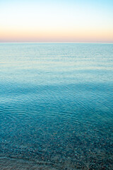 The surface of the water in the Issyk Kul mountain lake in Kyrgyzstan at sunset