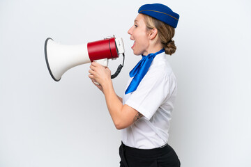 Fototapeta premium Airplane blonde stewardess woman isolated on white background shouting through a megaphone