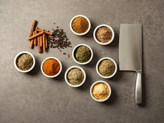 A variety of spices, seasonings and kitchen knife