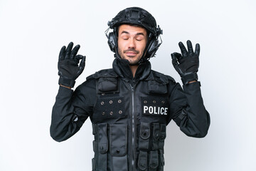 Young caucasian SWAT man isolated on white background in zen pose