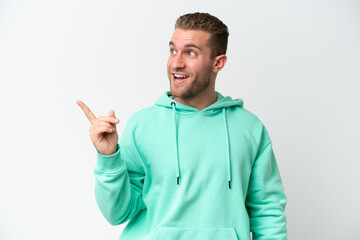 Young handsome caucasian man isolated on white background intending to realizes the solution while lifting a finger up