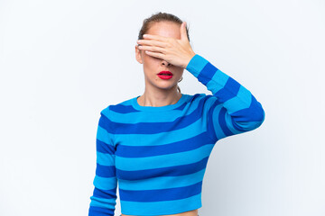 Young caucasian woman isolated on white background covering eyes by hands. Do not want to see...