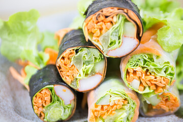 Fresh vegetable salad rolls on the table.