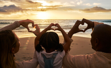 Beach, heart hands and family for love of summer, ocean and outdoor wellness with parents, child...