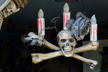 candlestick skull with bones. Halloween installation
