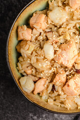 salmon rice on a dark background