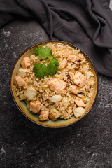 salmon rice on a dark background