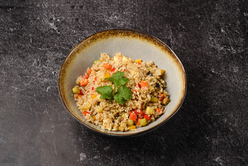 rice with vegetables on a dark background