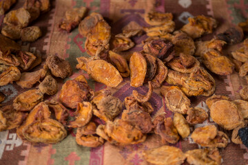 close-up shot of dried apples on rustic cloth