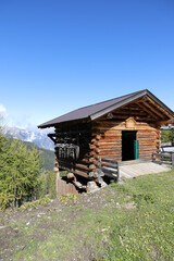 an old little crooked hut in the alps