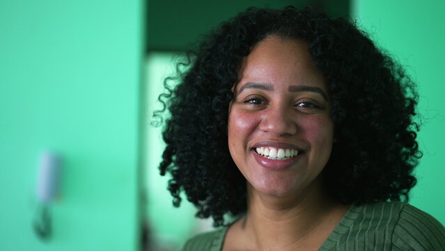 Portrait of a happy Brazilian black woman laughing at camera