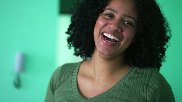 Portrait of a happy Brazilian black woman laughing at camera