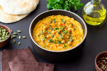 Pumpkin hummus with seeds and greens. Healthy eating. Vegetarian food.