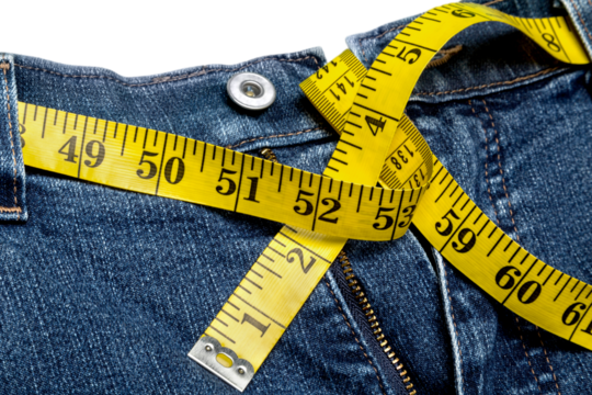 Jeans with centimeter in weight loss concept