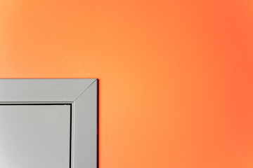 An image of the corner of a doorway on a painted wall. View of the corner of the door on the tinted...