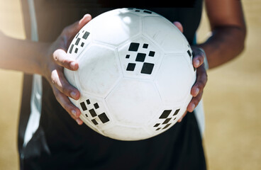 Soccer, hands and ball with a sports man on a grass pitch or field for fitness and exercise...