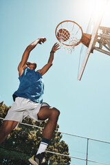 Basketball, sport and man with a goal during a game, professional event or training on an outdoor...